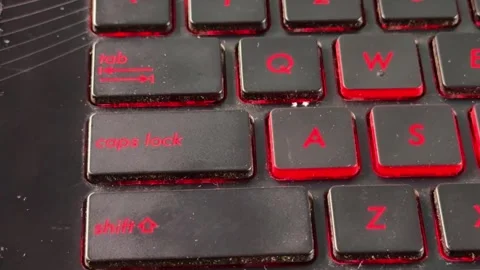 Finger pressing caps lock key on laptop keyboard, close up typing action, Stock Footage 333607435