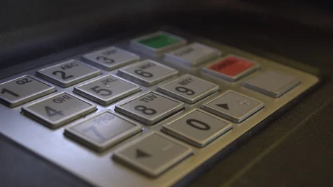 Finger pressing in code at ATM 4k Stockbeeldmateriaal 112880563