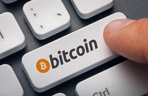 Finger pressing computer key with bitcoin logo. crypto mining concept Stock Illustration