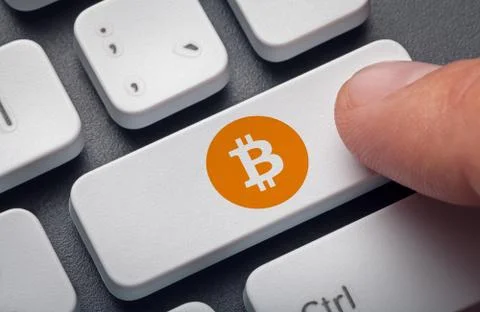 Finger pressing computer key bitcoin symbol. crypto mining concept Stock Illustration