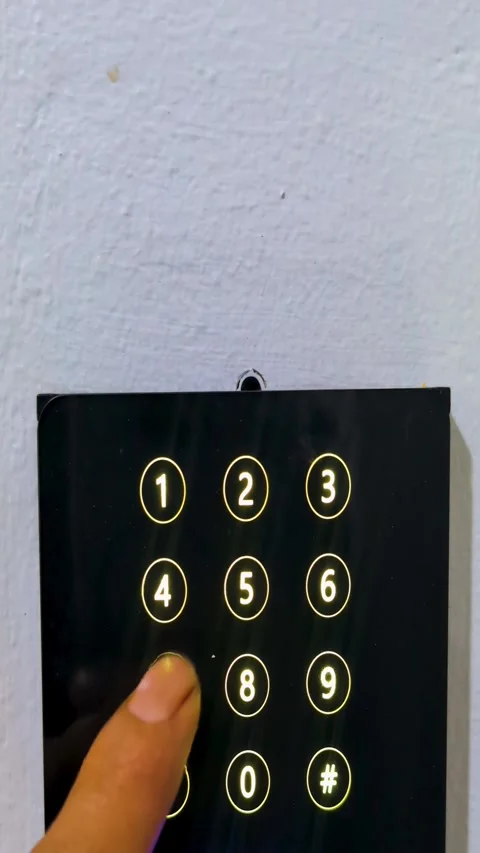 Finger pressing digital keypad password pin code for secure door entrance a.. Stock Footage 341827067