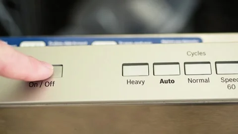 Finger pressing the dishwasher power on button Video stock 329068018
