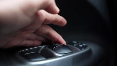 Finger Pressing Electric Car Window Switch Stock Footage 335958922