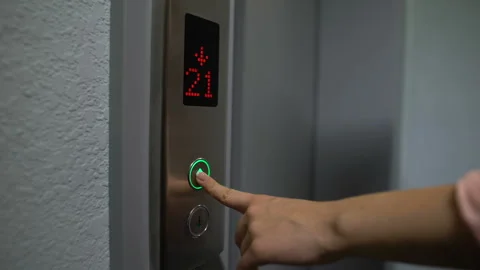 Finger pressing elevator button to upper floor, electronic LCD display, closeup Stock Footage 115953462