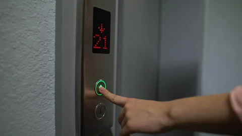 Finger pressing elevator button to upper floor, electronic LCD display, closeup Stock Footage 115956335