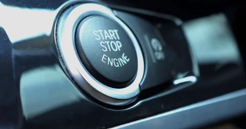 Finger pressing engine start stop button Stock Footage 83929335