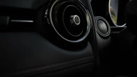 Finger pressing engine stop button of a car Stock Footage 87245687