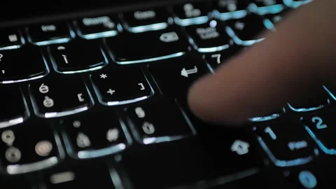 Finger pressing an enter key. Computer user hitting the enter key, up close Stock Footage 226225568