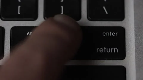 Finger pressing enter - return key on keyboard. Macro view Stock Footage 164878955