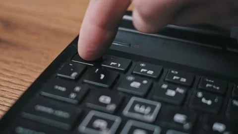 Finger Pressing ESC Key On Dusty Keyboard Stock Footage 320579482