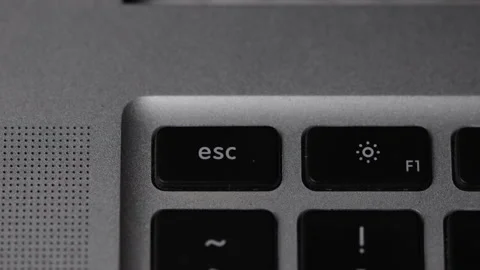 Finger pressing esc key on keyboard. Macro view Stock Footage 164879140