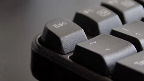 Finger pressing escape on keyboard Stock Footage 331127184