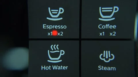 Finger pressing espresso button in automatic coffee machine Stock Footage 279377272