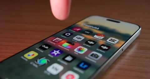 Finger pressing Final Cut Pro icon on Apple iPhone screen Stock Footage 302230757