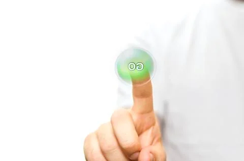 A finger pressing a green go button Stock Photos