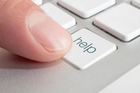 Finger pressing a help computer key Stock Photos