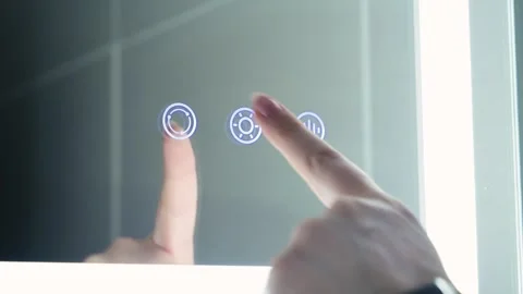 Finger pressing illuminated touch controls on smart mirror in  bathroom. Stock Footage 336724171