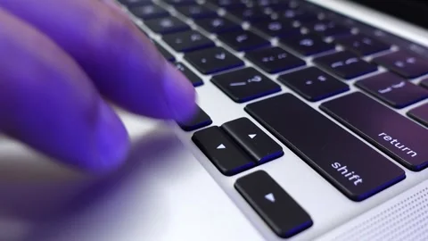 A finger pressing keyboard keys during computer work Stock Footage 312413451