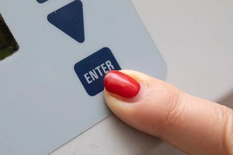 Finger pressing on a keypad Stock Photos