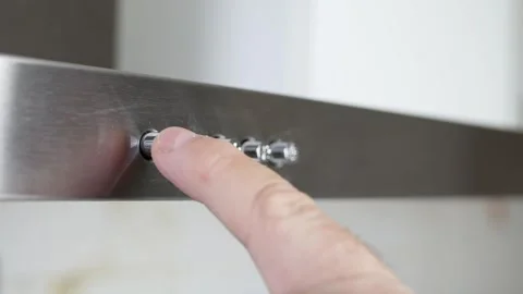 Finger Pressing Kitchen Range Hood Power Button Closeup. Man Pressing Stainless Stock Footage 340034661