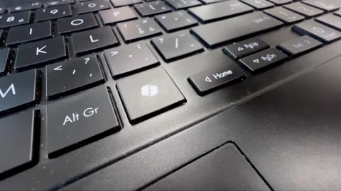 Finger pressing the Microsoft Copilot AI key on laptop keyboard accessing Stock Footage 334837351