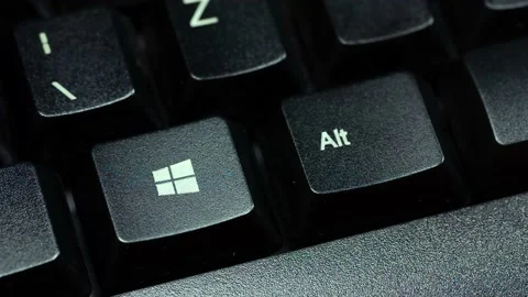 Finger pressing the Microsoft Windows 10 operating system key on a keyboard Stock Footage 143789758