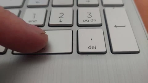 Finger Pressing Number Zero Insert Key on Laptop Numeric Keypad Stock Footage 333642113