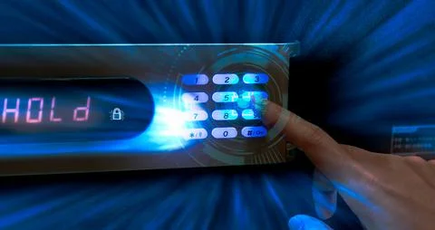 Finger pressing password code on safe box to open metal safe in hotel. Cyber  Stock Photos