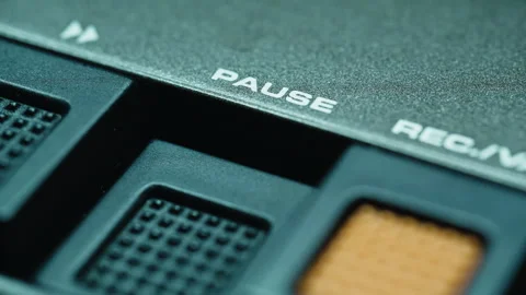 Finger pressing pause button on retro tape player closeup. Thumb touching panel Stock Footage 332364469