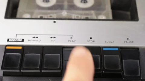 Finger pressing on play, pause button and stop. Retro cassette tape player. Stock Footage 114695670