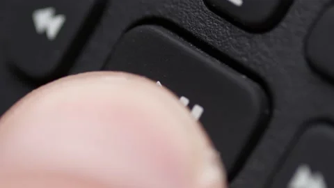 Finger Pressing the Play Pause Button on a TV Remote Control Closeup Stock Footage 166703975