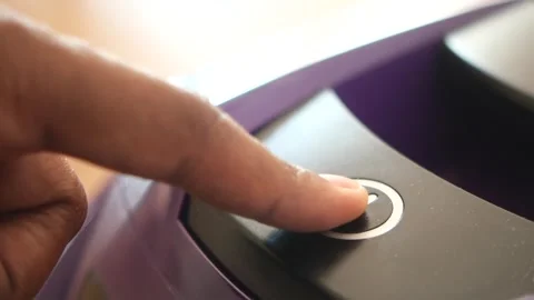 Finger pressing power button on electronic device motion close up detail. Stock Footage 332782872