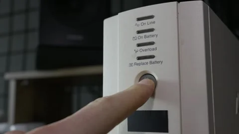 Finger Pressing Power Button On Uninterruptible Power Supply Stock Footage 329487574