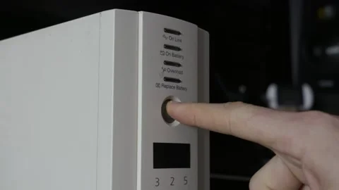 Finger Pressing Power Button On White Uninterruptible Power Supply Unit Stock Footage 327852269