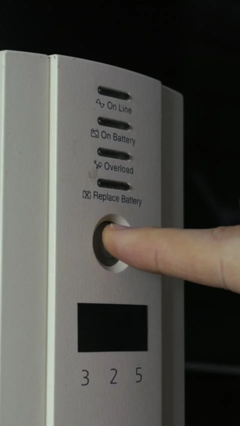 Finger Pressing Power Button on White UPS Battery Backup System 스톡 동영상 329964848