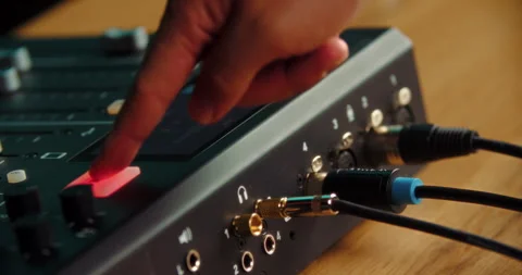 Finger pressing record button on professional audio mixer Stock Footage 316247428