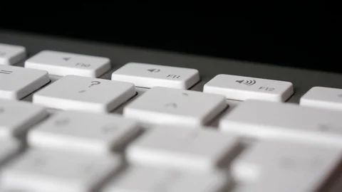 Finger pressing repeatedly the F12 function key on keyboard. Close-up Stock Footage 125406573