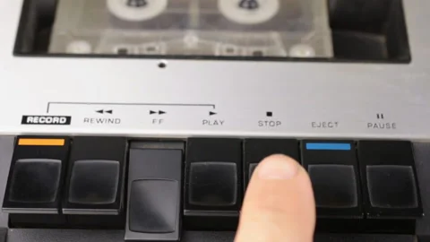 Finger pressing the rewind button and stop. Retro cassette tape player. Stock Footage 114695654