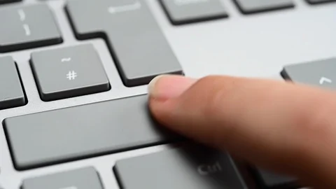 Finger pressing the shift key Stock Footage 124307034