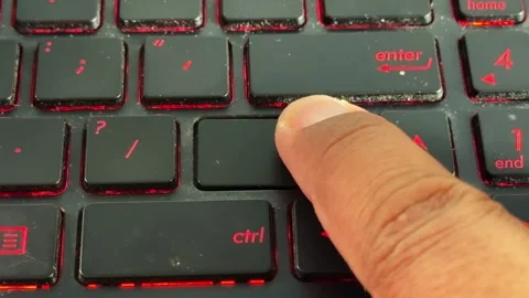 Finger pressing "shift" keys on glowing keyboard, Stock Footage 334637745
