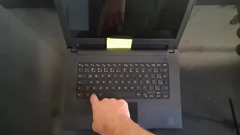 Finger pressing specific keyboard key on modern laptop video footage clip Stock Footage 339301853