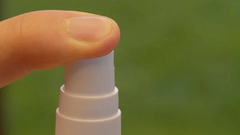 Finger pressing the spray Stock Footage 137646434