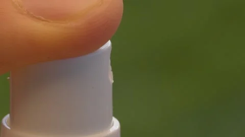 Finger pressing the spray Stock Footage 139650037