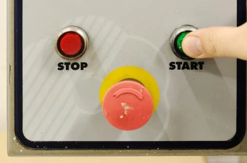 Finger pressing start button Stock Photos