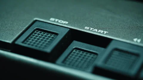 Finger pressing start button tape player closeup. Hands touching music equipment Stock Footage 332363717