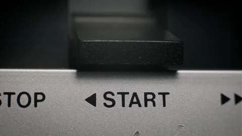 Finger Pressing Start Button on Vintage Audio Deck Stock Footage 319584902