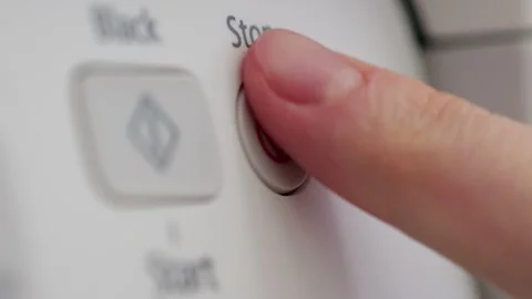 Finger pressing stop button on control panel in slow motion Stock Footage 306193324