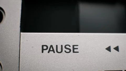 Finger Pressing Textured Black Pause Button Macro Stock Footage 320584676