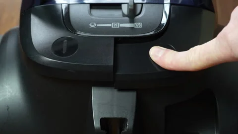 Finger Pressing Vacuum Button in Close-up View Stock Footage 306460656