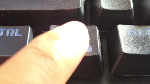 Finger pressing the Windows lock key Stock Footage 338427375